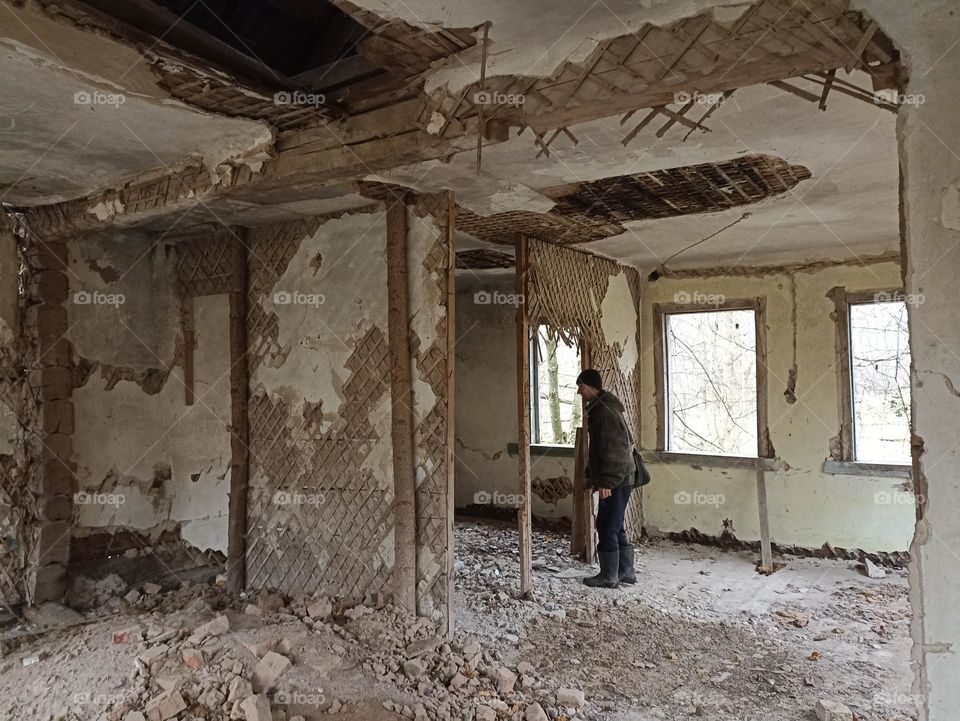 A man in an abandoned house
