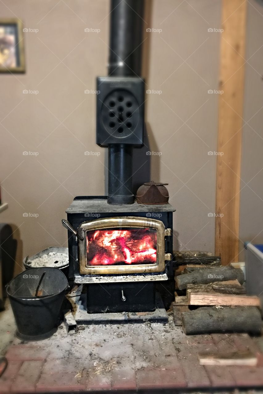 Heating with a wood stove can save you money, but it's a lot of hard work.