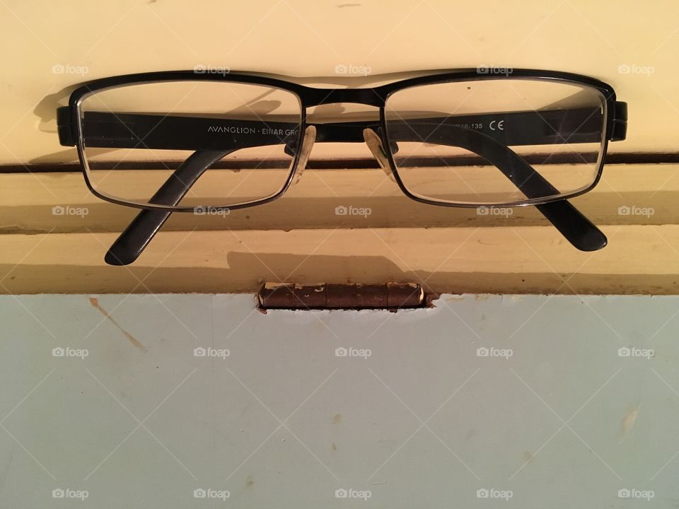 Pareidolia glasses on wooden table