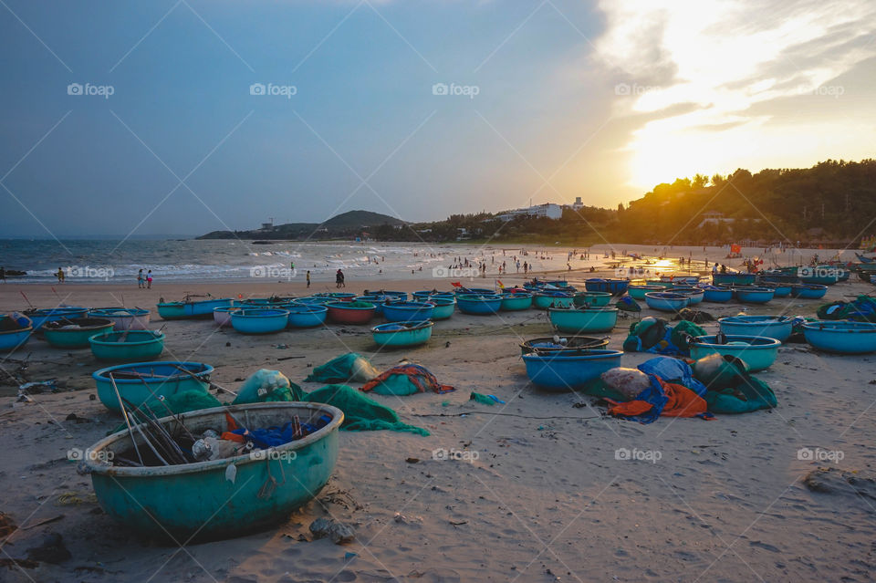 Round fishing boats at sunset in Mui Ne, Vietnam 