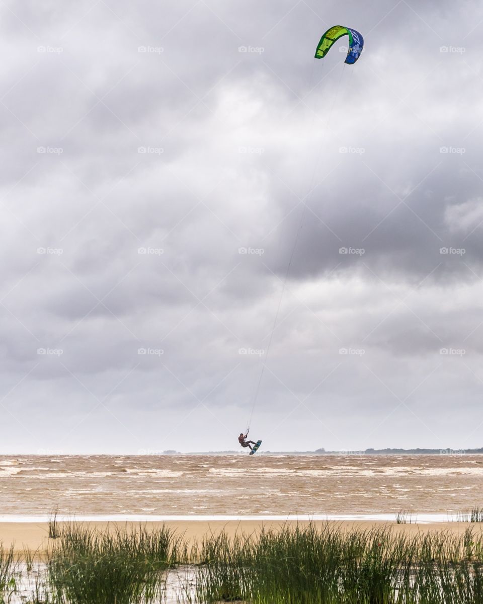 "Up in the air"

http://www.picardo.photography/Portfolio/Landscapes/i-Wqx3Fnn/A

Given the very windy conditions during the last weekend in the uruguayan coast, some guys decided to ride their kites and learn to fly!
Juan Lacaze, Colonia, Uruguay.  