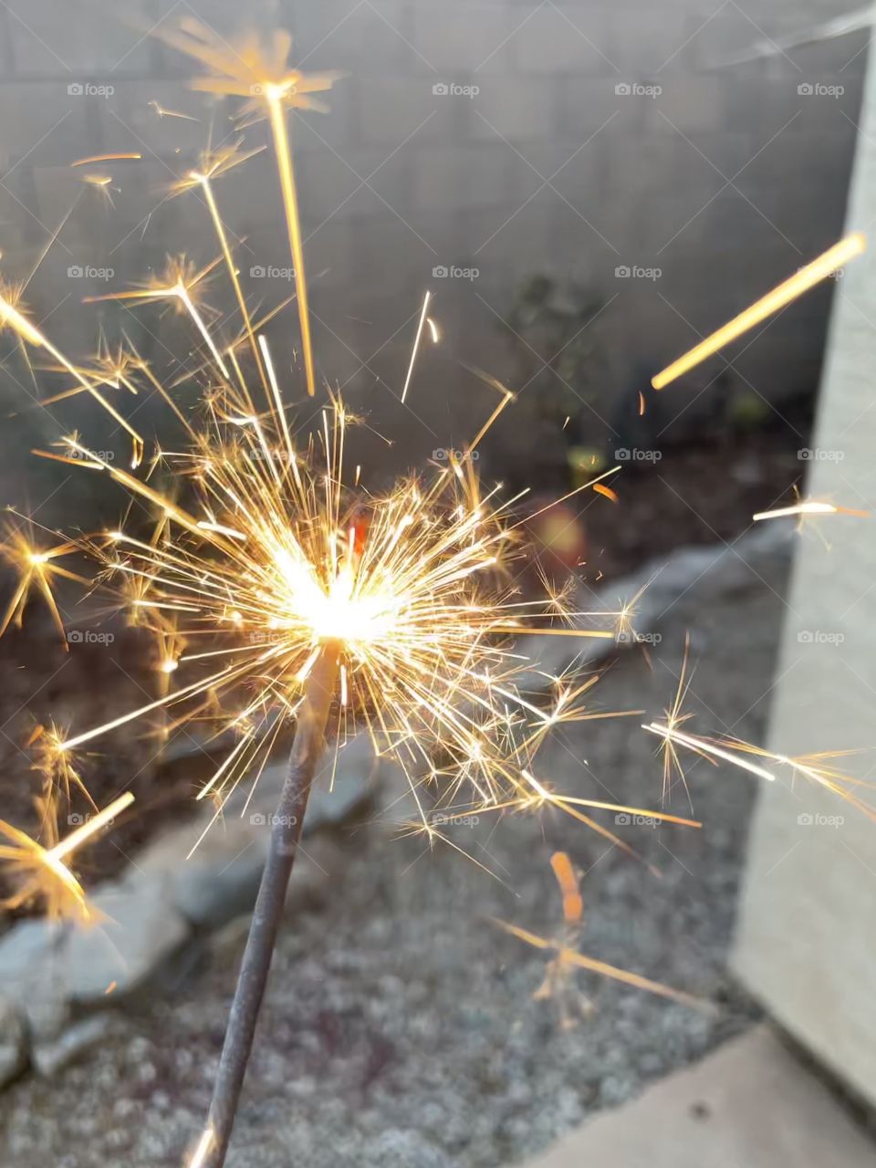 Sparklers on the Fourth of July. It looks so magical. 