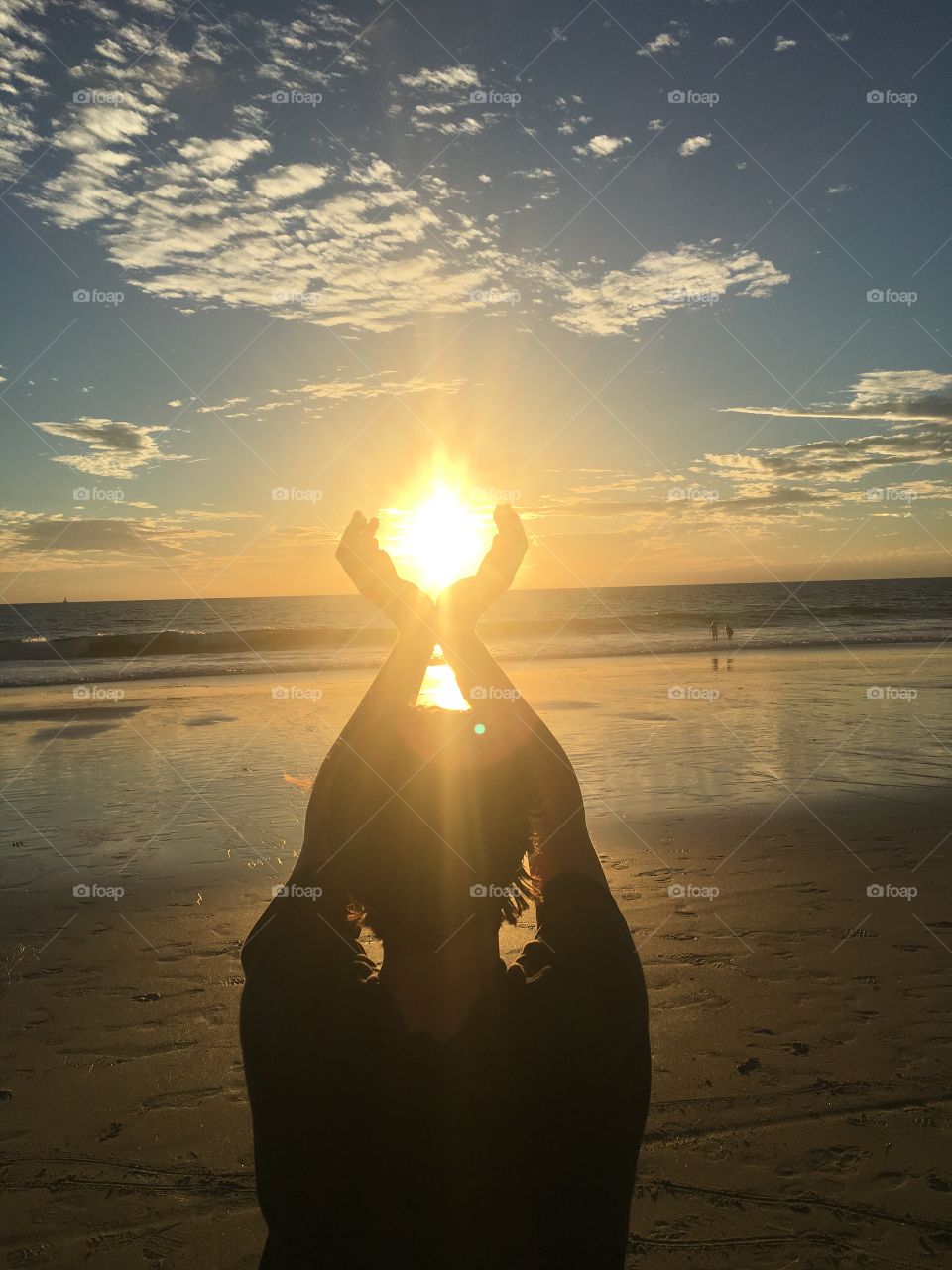Holding sun in hands