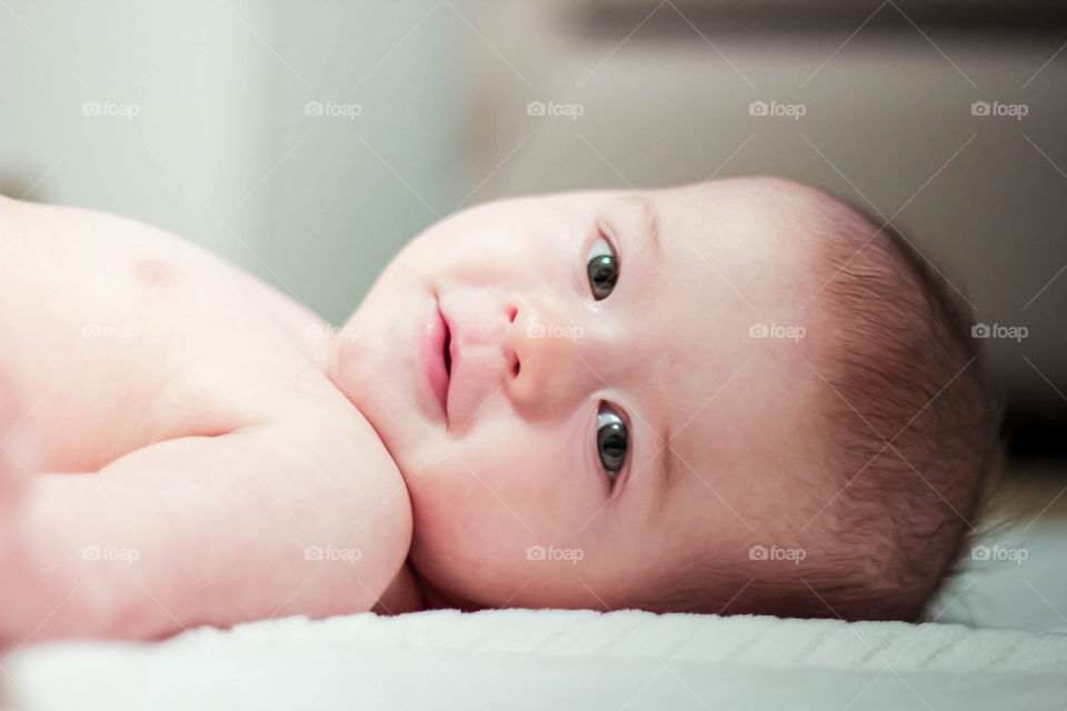 Smiling baby laying down