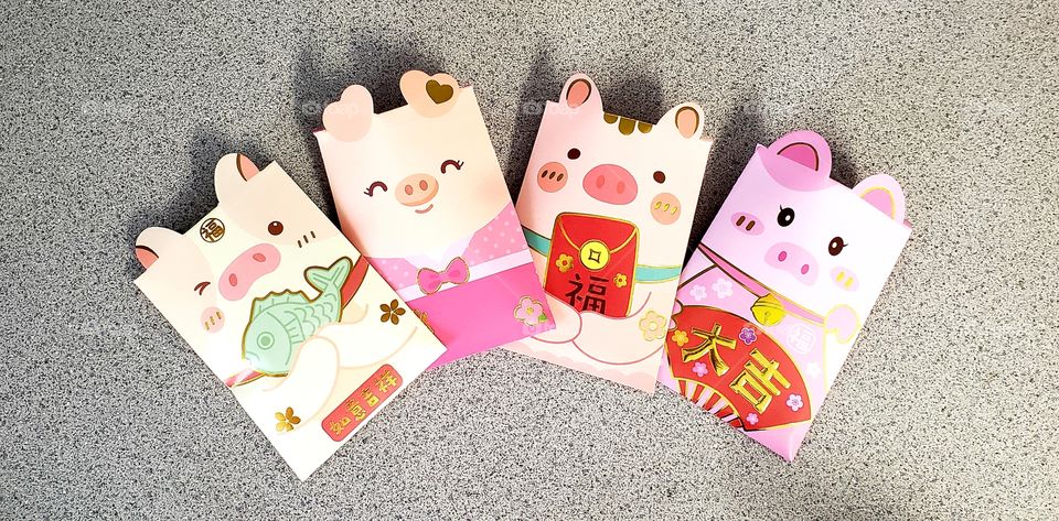 Celebrating Chinese New Year - year of the pig.  Not so traditional red envelopes but oh so cute!