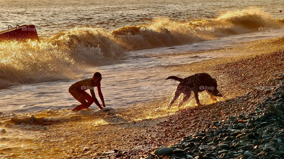 children and waves and dog