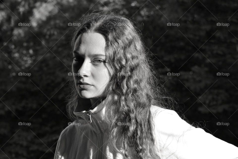 girl in sunlight beautiful portrait black and white background