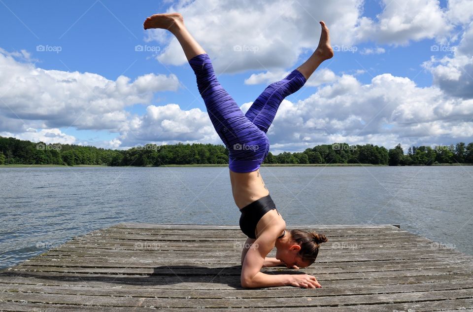 Yoga on the pier at the lakeside