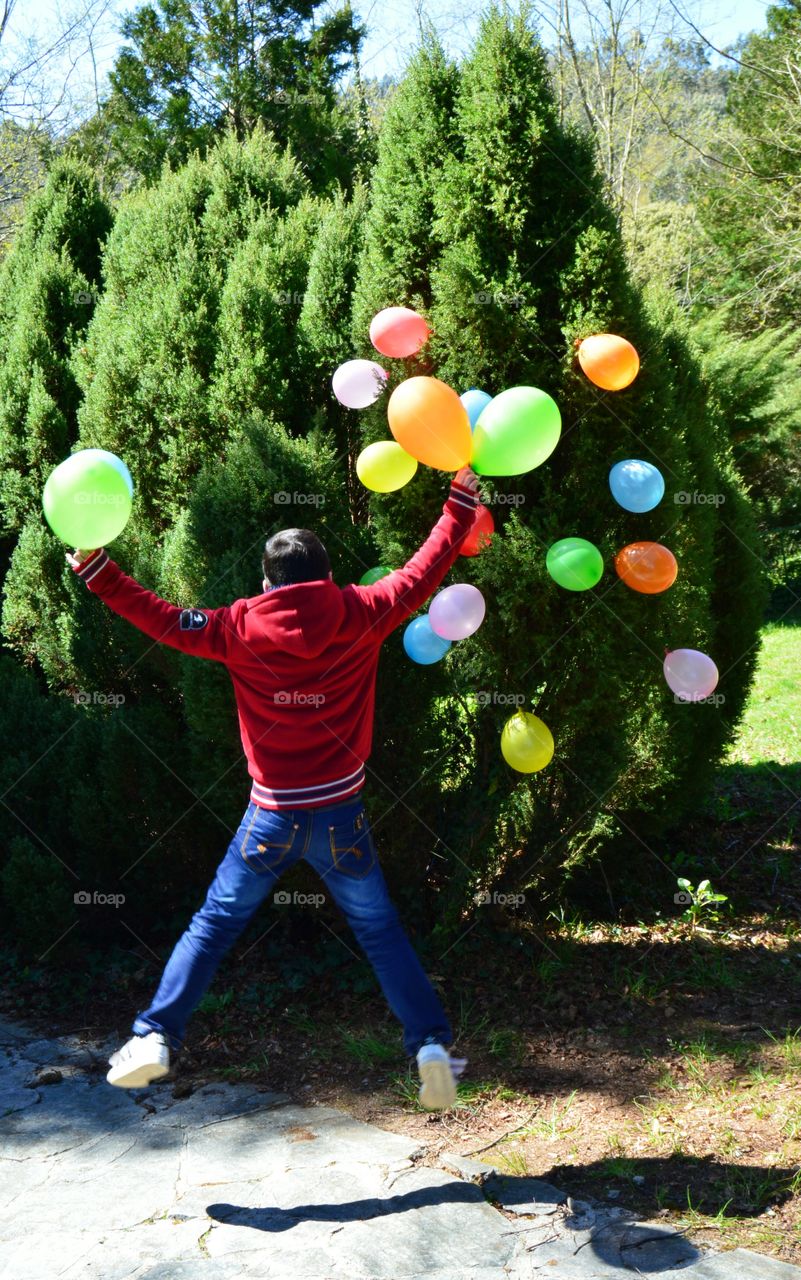 Spring balloons. My kid playing around with balloons in the park