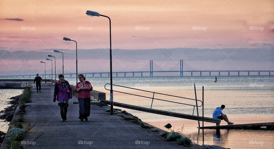 Walking the pier in sunset 