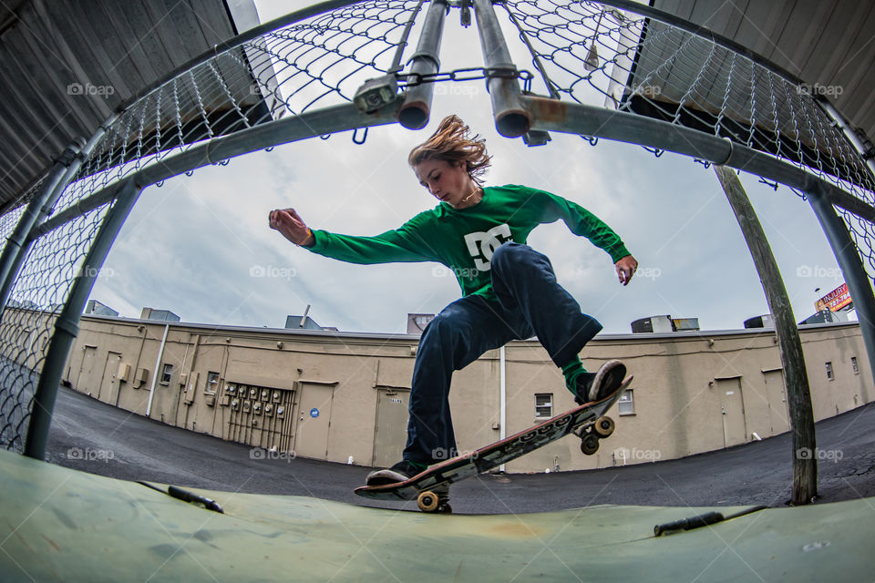 Skateboarder doing a grind 