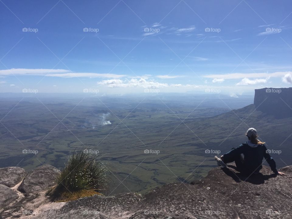 Woman sitting on Mount Roraima