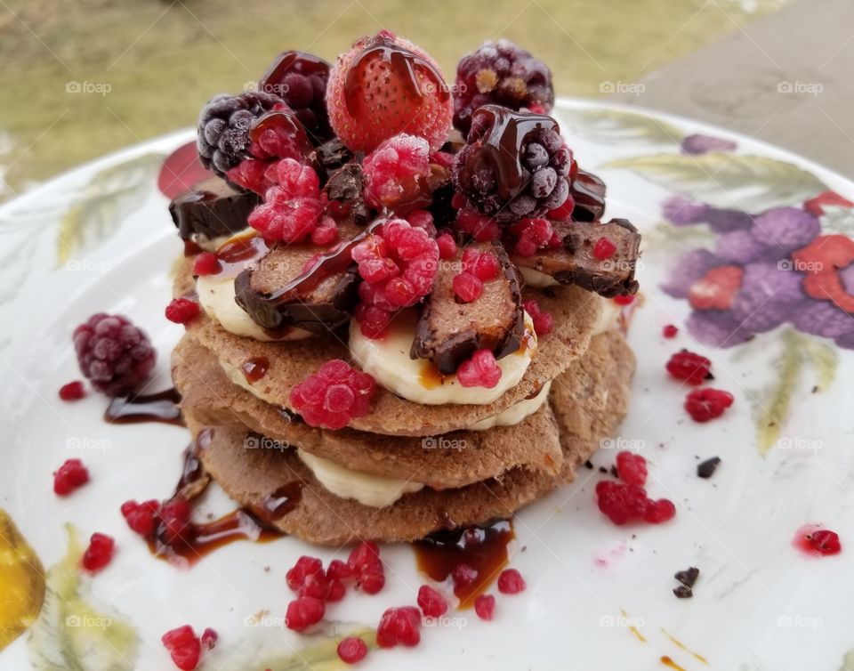 Strawberry Banana Oatmeal Pancakes with Raspberry Built Bar, Peanut Butter Honey BuiltGO, and Strawberry Banana Plant-based OWYN protein.