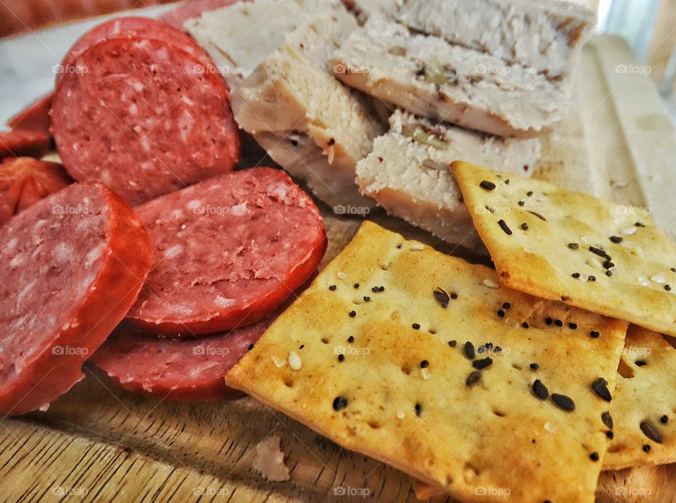 Crackers, Cheese, And Salami. Snacking Selection Of Cured Meats And Cheese
