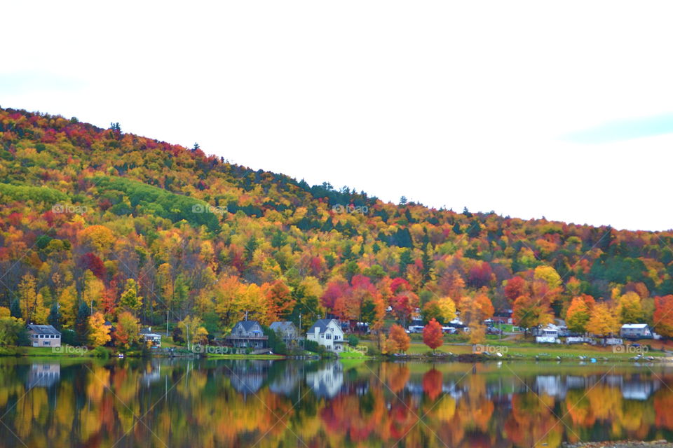 Fall in New Hampshire. off a NH road we traversed an unpaved road leading to a lake of jaw-dropping views of fall