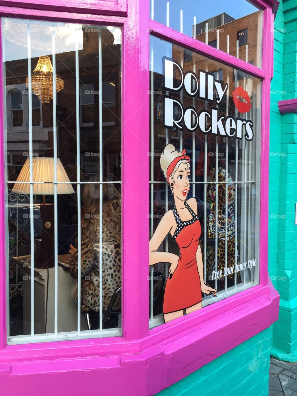 The brightly painted, cheerful window of a fashion clothing store in the UK. #windowsaroundtheworld