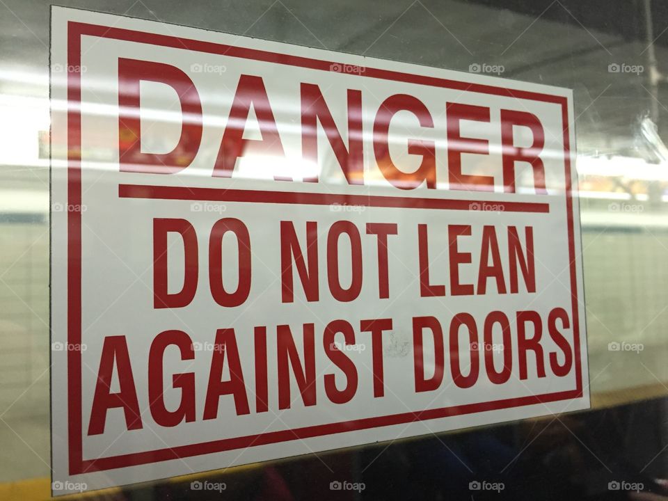 Danger! Do not lean against doors