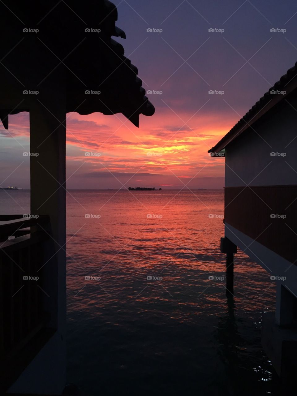 Sunset over the Malacca Strait. Happened to be strolling back from the pool when the sky suddenly took on this beautiful reddish hue. No photoshop. 