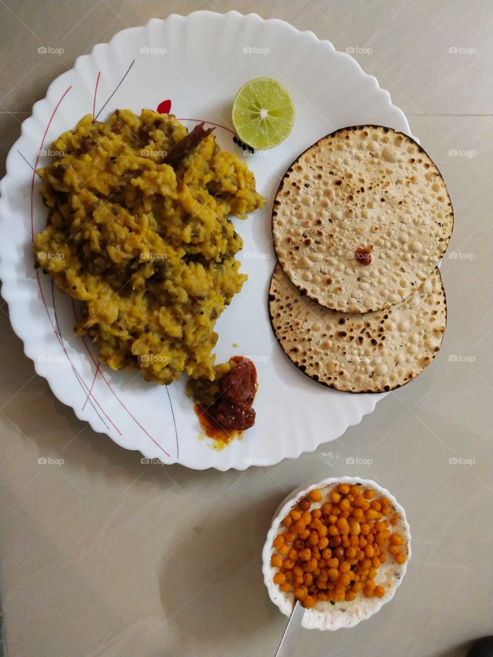 Tahri (also tehri, tehari or tayari) is a yellow rice dish in Awadhi cuisine. Spices are added to plain cooked rice for flavor and colour. In one version of Tehri, potatoes are added to the rice.