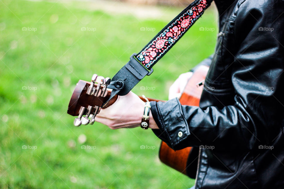 Yin yang bracelet while playing guitar