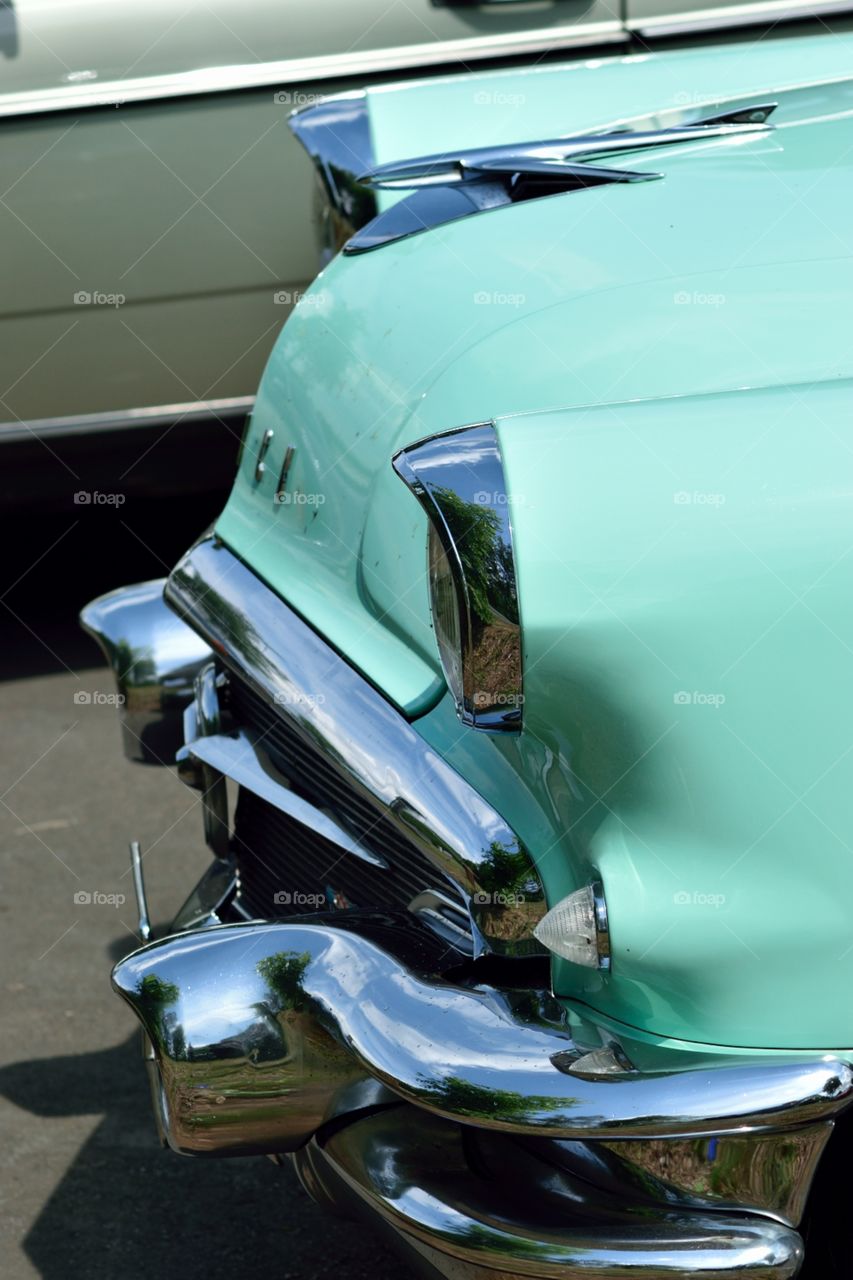 Mint green oldtimer with chrome bumper