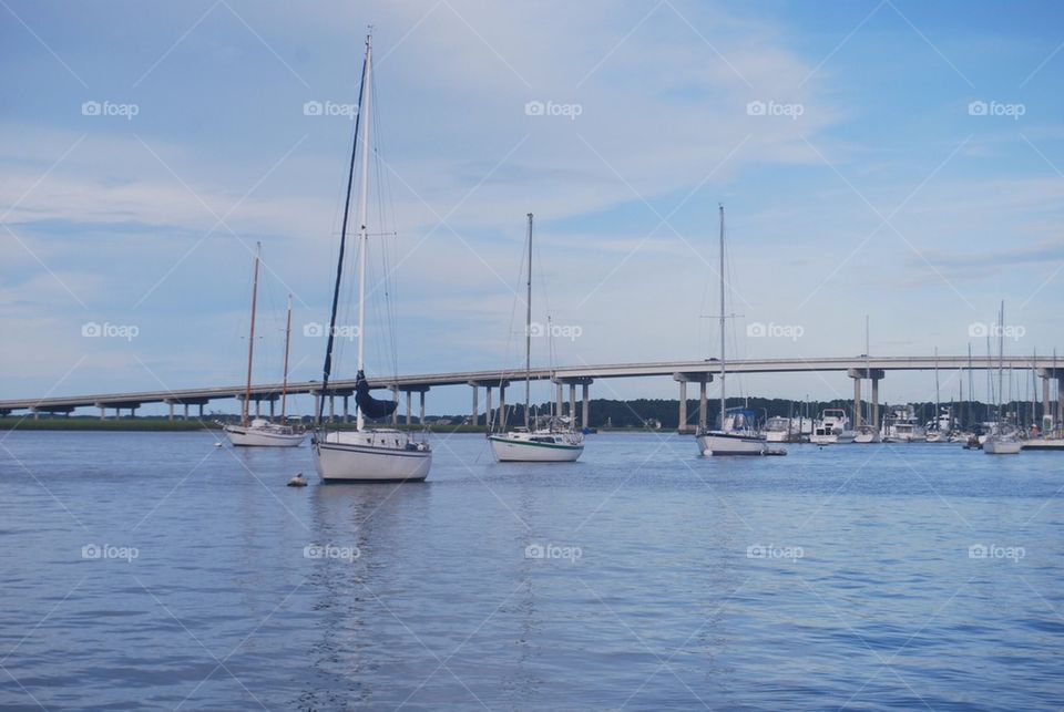 Sail boat bridge water