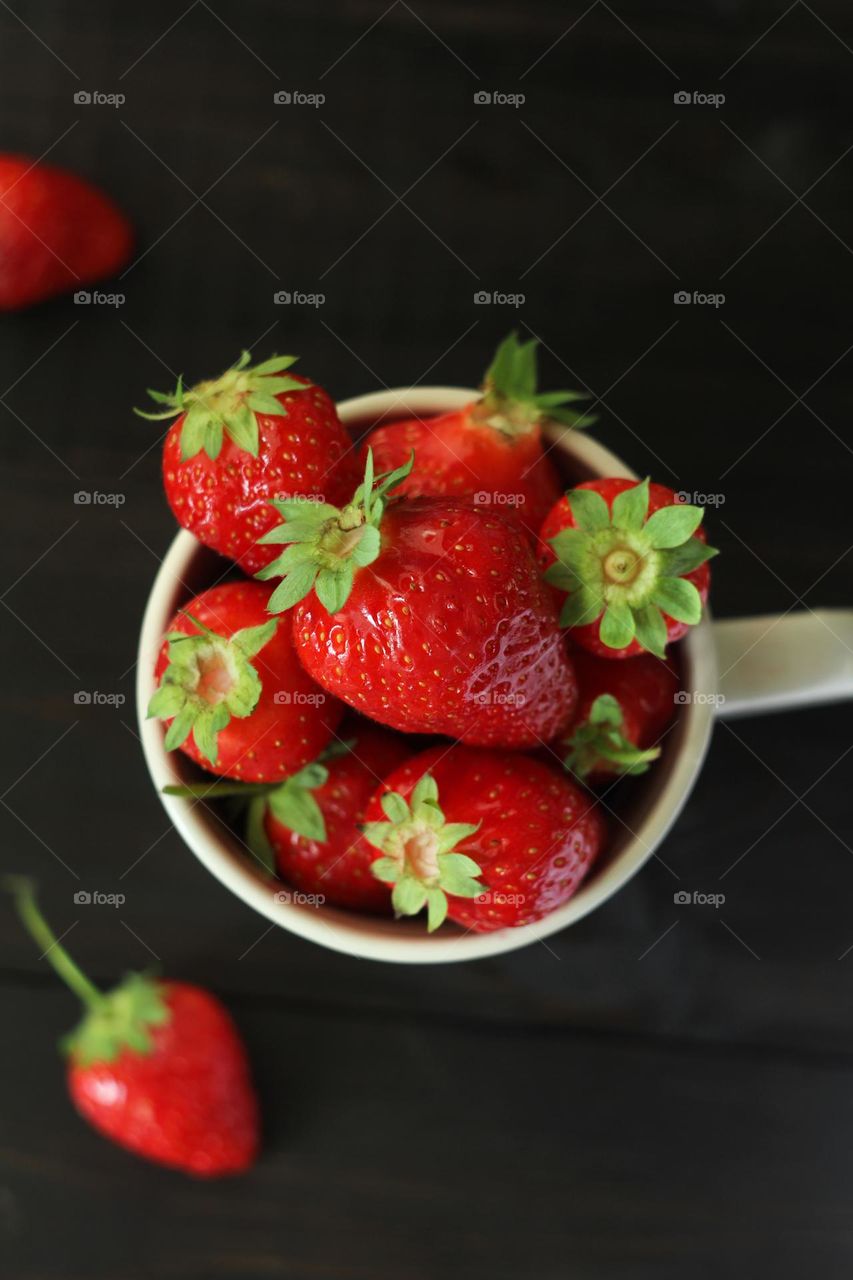 Fresh strawberries in a mug