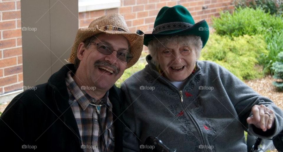 Western days. Western days at an assistive living center , senior resident with son visiting .