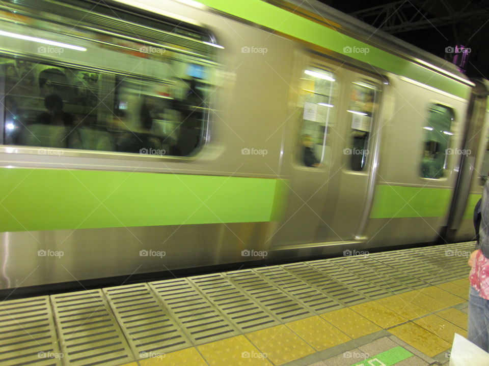 Fast Moving Train, Tokyo, Japan. City Life.  Motion Blur. Bright. Urban.