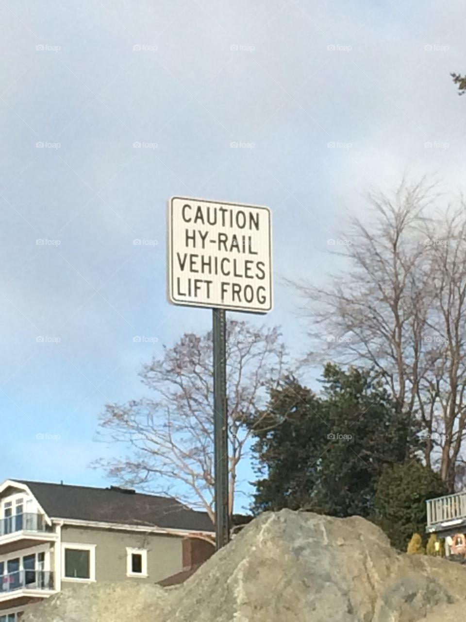 A funny sign seen on a rail road.