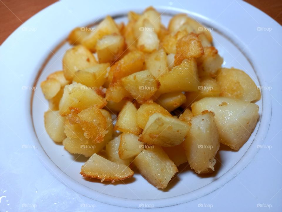 fried potatoes on the plate
