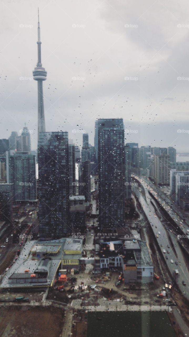 Ontario, view from above, high rise, CN Tower, rainy day, blurry buildings, traffic, busy city, city landscape, cityscape, blurry photo, rainy day, grey skies, winter in the city, Canada, ON