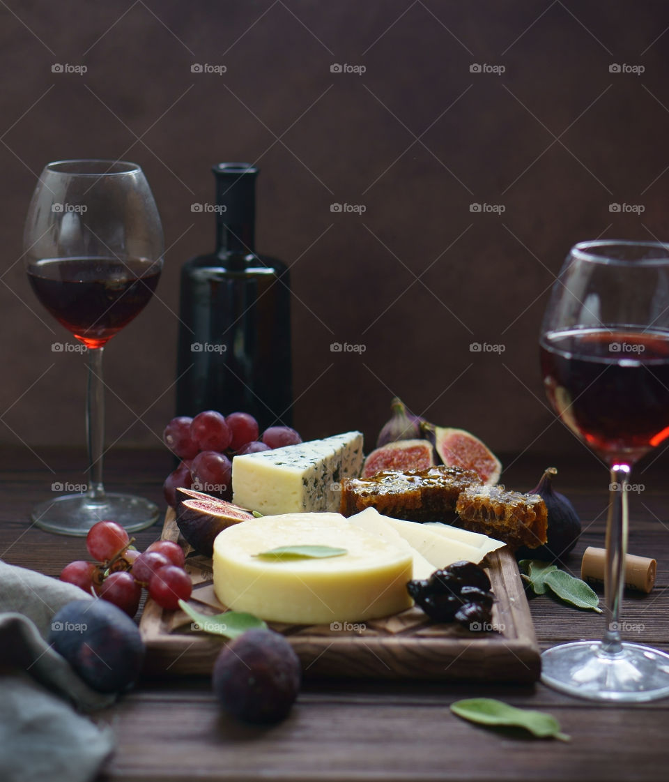 cheese and fruit board and wine