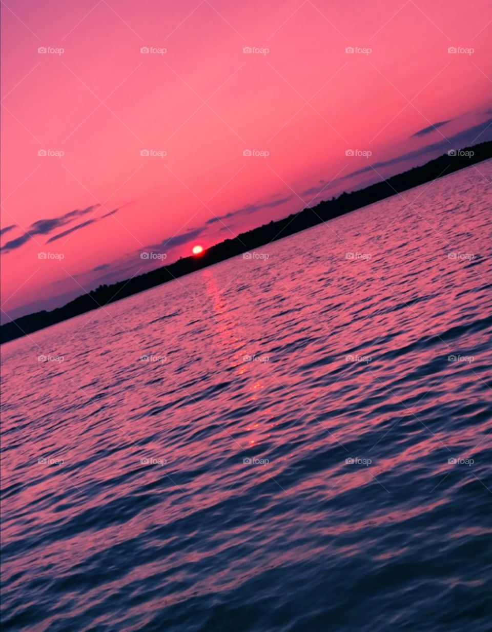 Pink and purple sunset over Hamlin Lake—taken in Ludington, Michigan 