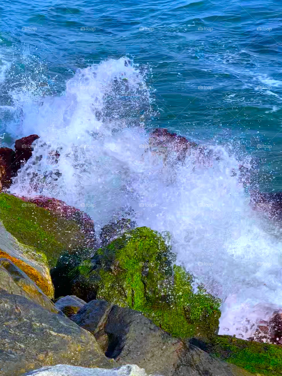 wave crashing against rocks