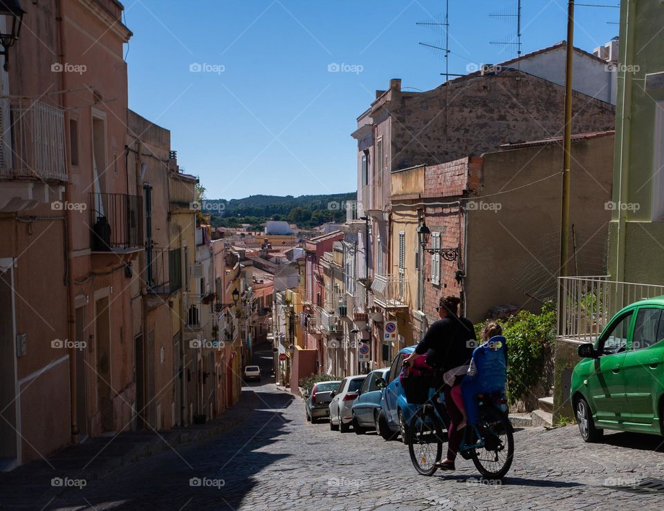 Bicyclist on street of an old Mediterranean city 