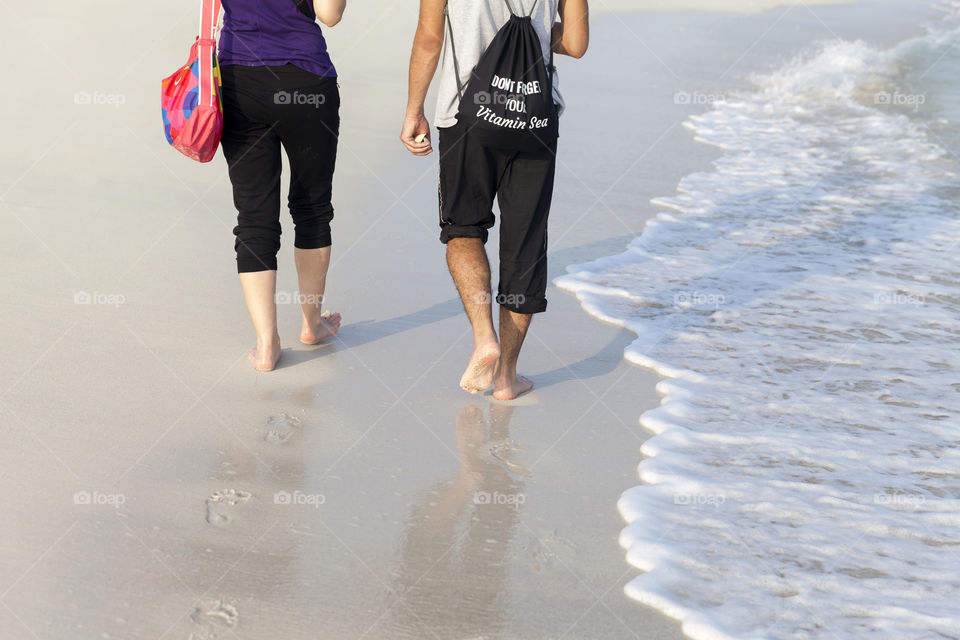 Couple walking at the beach