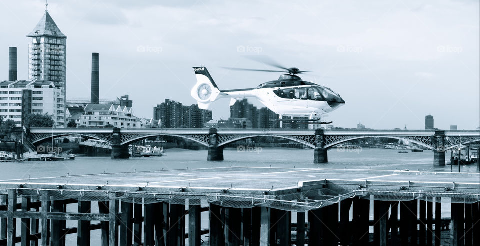 battersea heliport hovering helicopter landing area bridge by angeljack