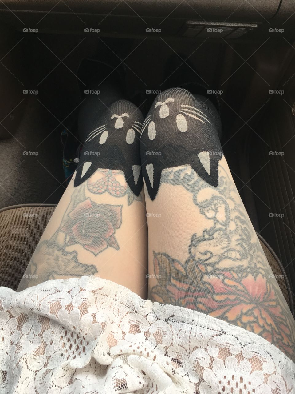 girls legs with tattoos and tights