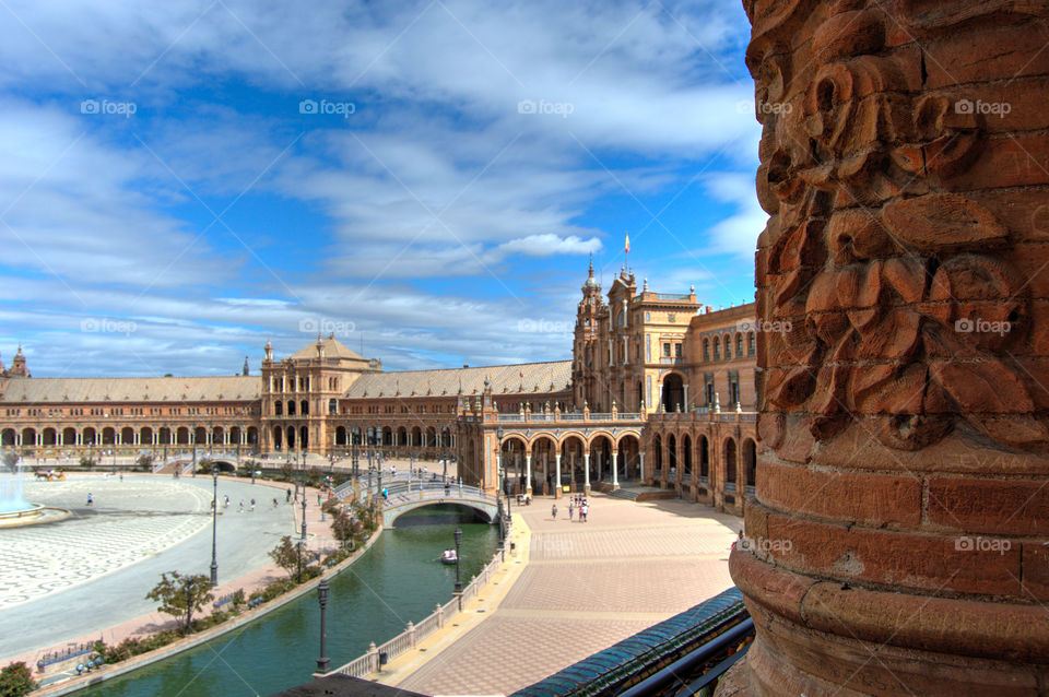 View of Plaza de España in Sevilla, with its characteristic buildings, canals and bridges.