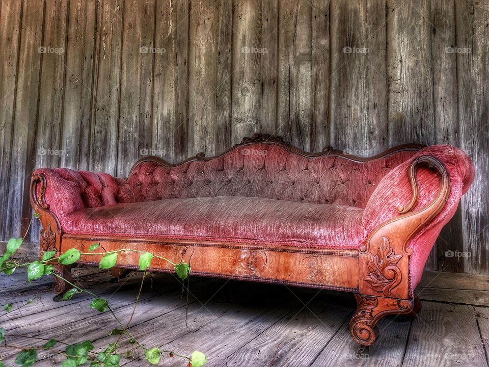 Yesterday’s Beauty Final Photo- Abandoned Victorian style couch on front porch of abandoned house😳