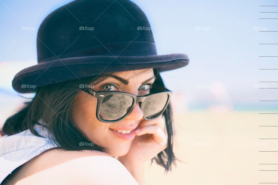 Portrait of a young woman in hat