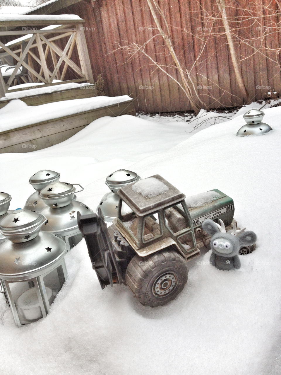 silver lanterns and toy tractor