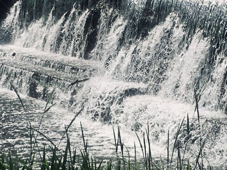 Weir on the River Lea at the southern end of The Broadwater in Brocket Park, Hertfordshire 