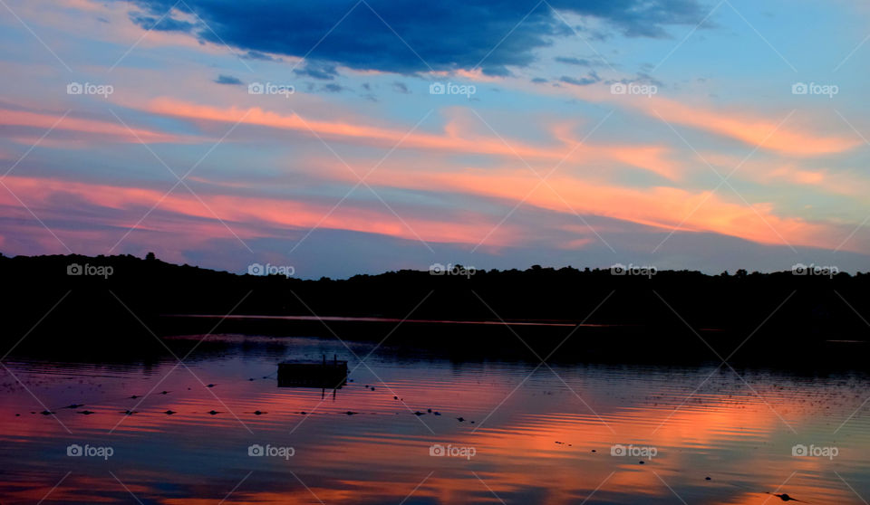 Scenic view of lake during sunset