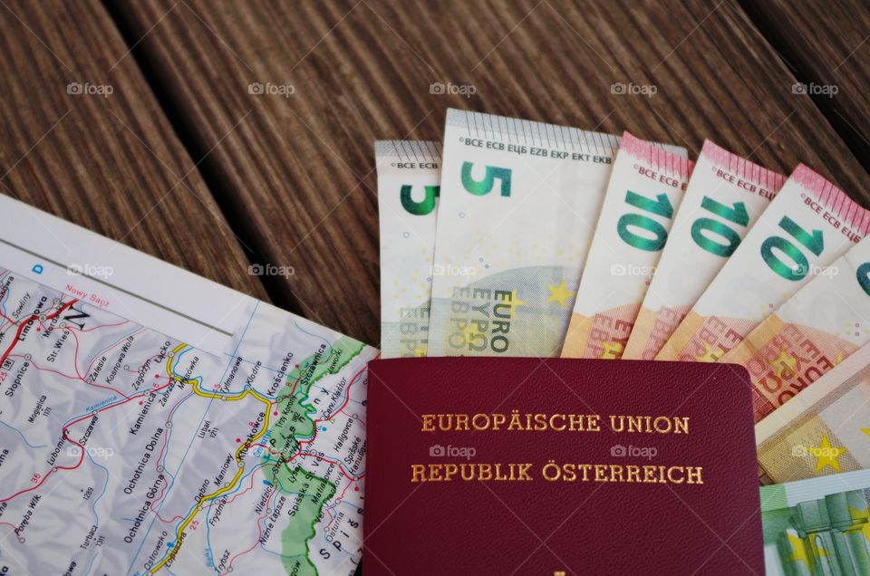 Passport and money on table