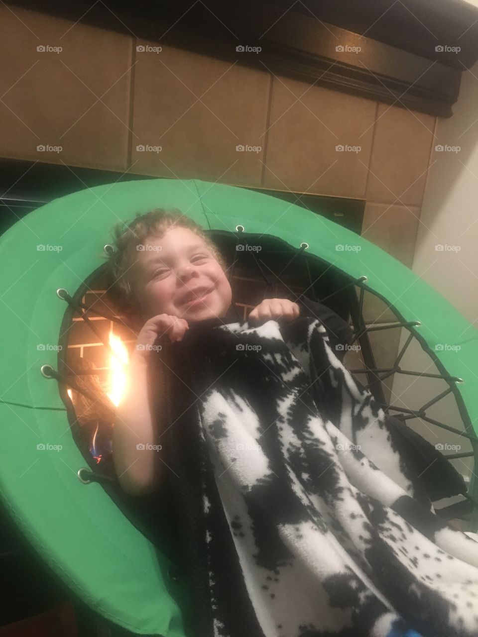 Keeping warm with a blanket by the fire 