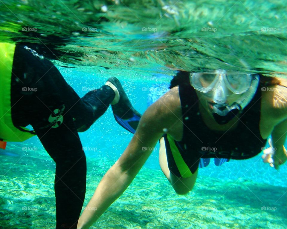 underwater couple snorkling