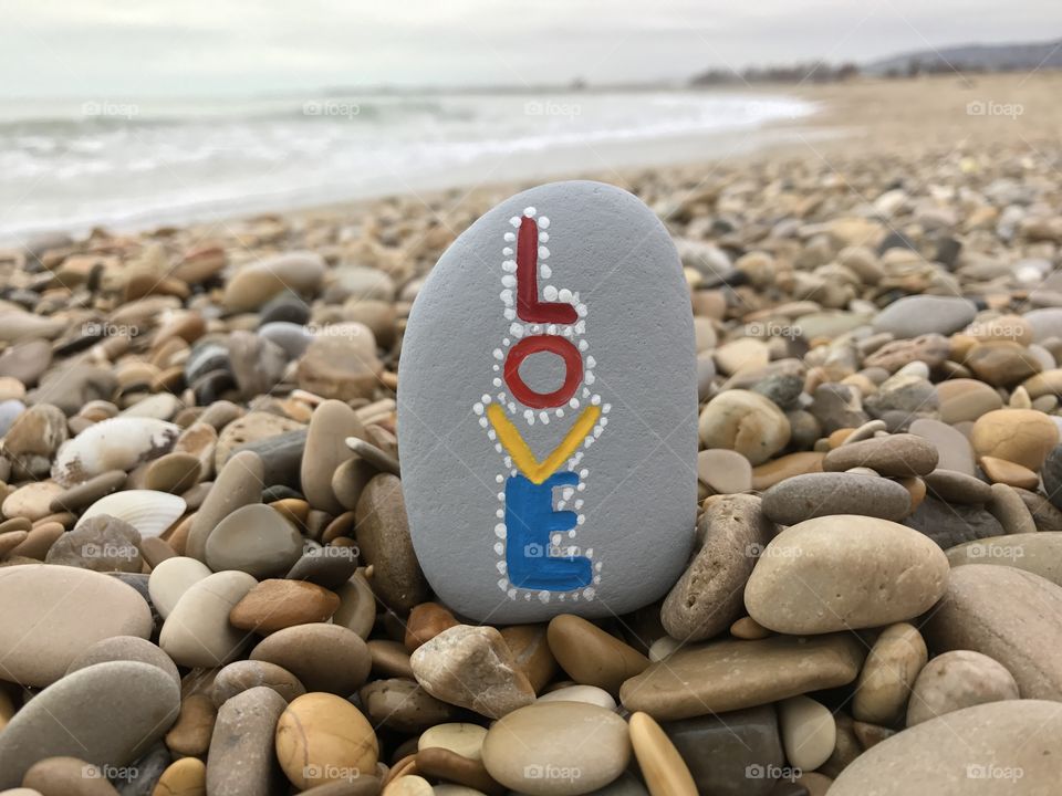 Love word painted on a stone