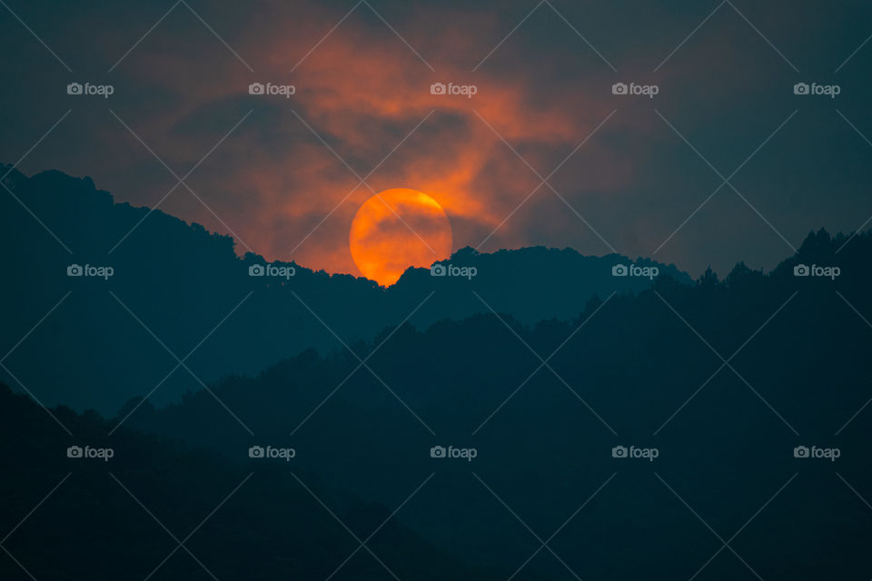 Sunset view behind the hills